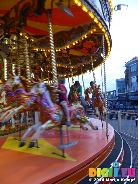 FZ005446 Lib and Jenni on carousel in Cardiff Bay